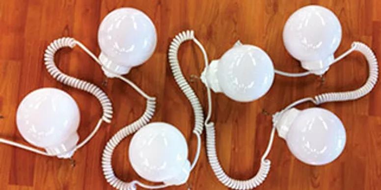 White globe string lights on wooden surface