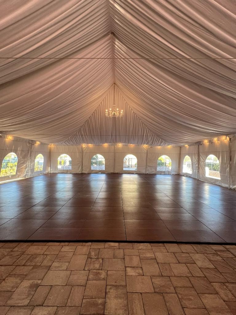 Tent liner draped along ceiling of event tent
